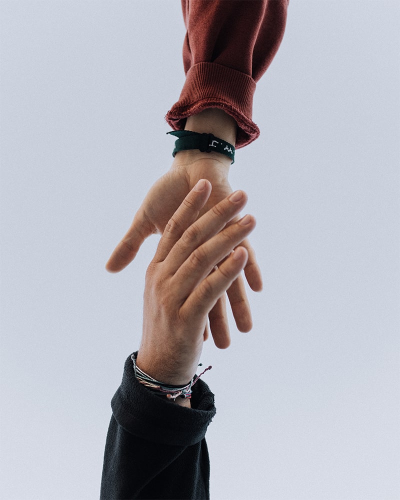 Two hands clasping | Photo by Austin Kehmeier on Unsplash