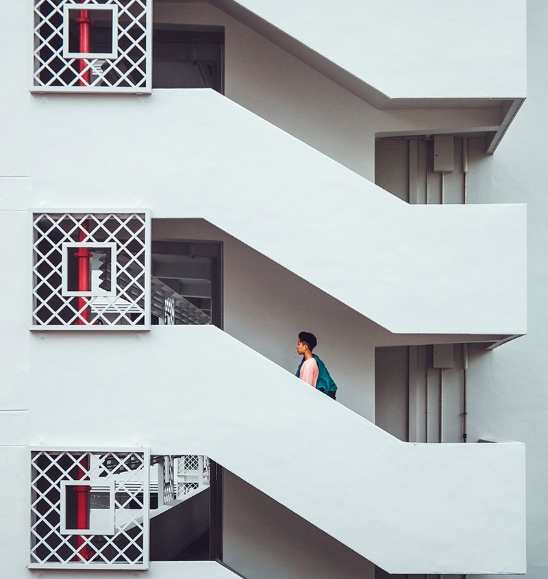 Man Walking up the stairs | Photo by John T on Unsplash